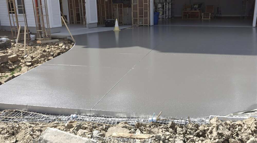 New concrete garage entrance and apron pour with reinforcement at the slab edge