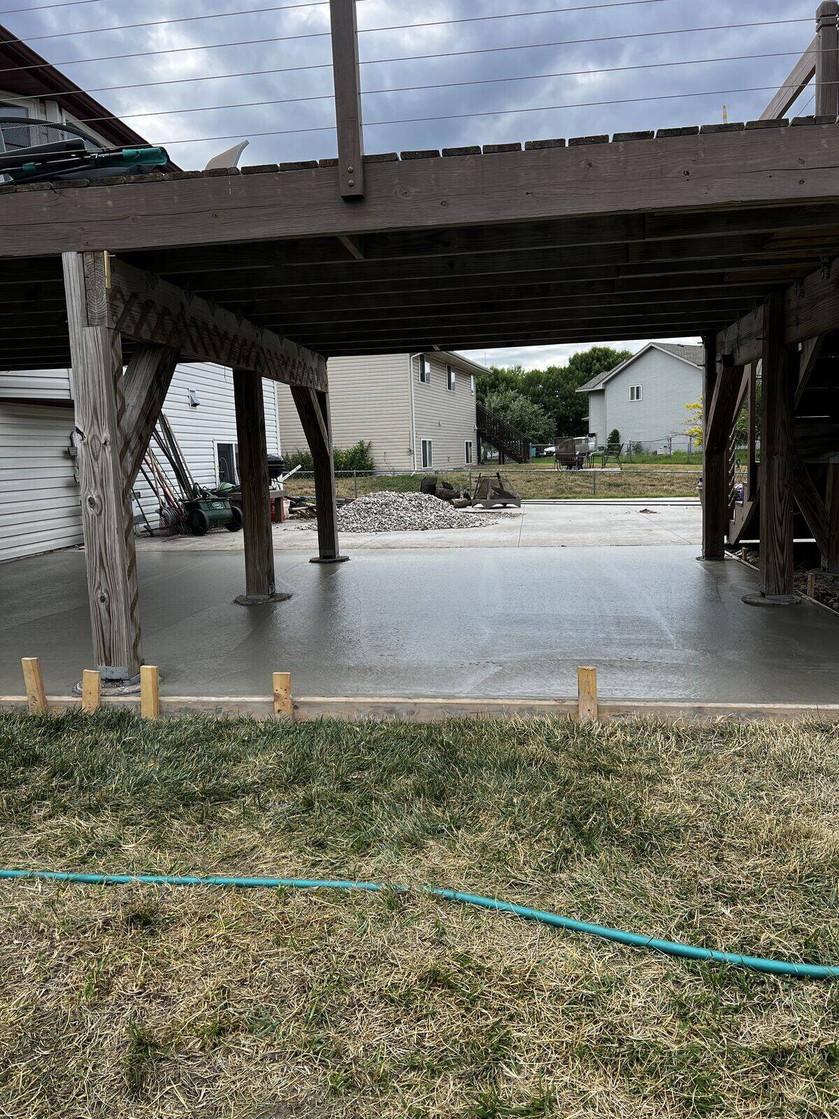 Freshly poured concrete slab curing on a residential project